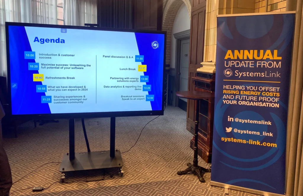 SystemsLink banner and agenda on screen