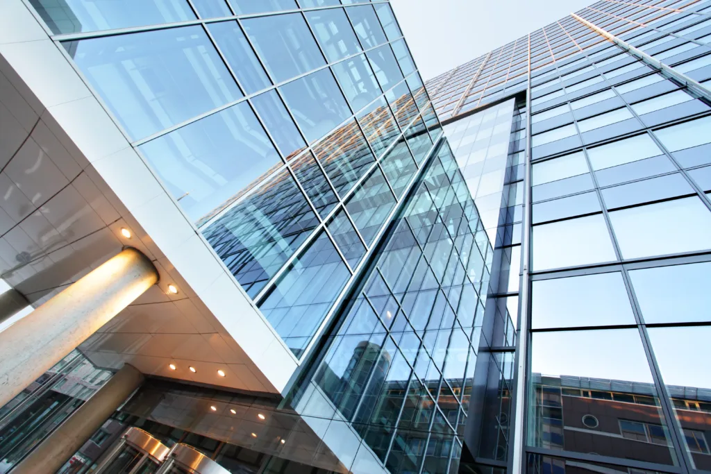 Low angle shot of skyscraper building with glass windows
