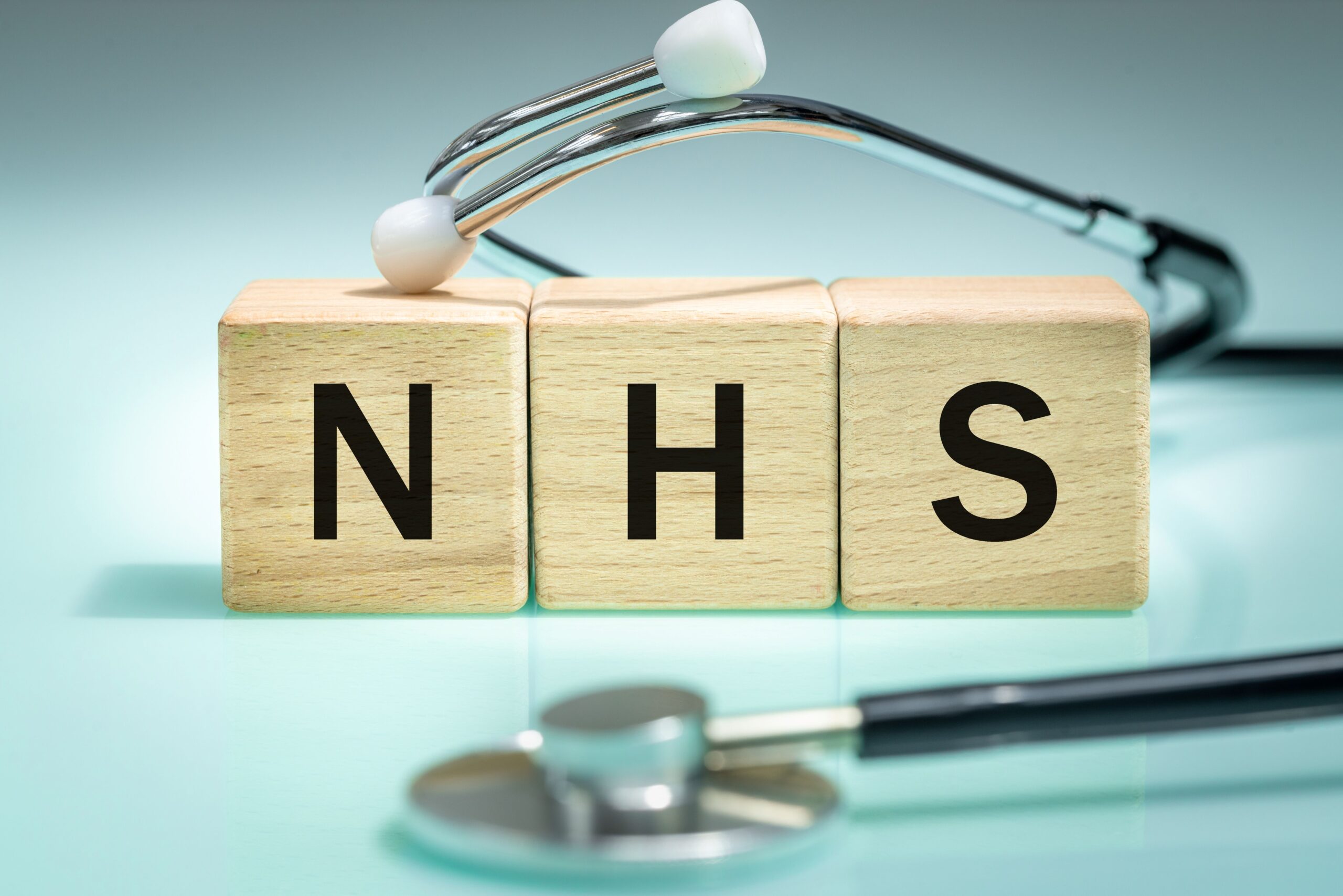 NHS letters on wooden blocks